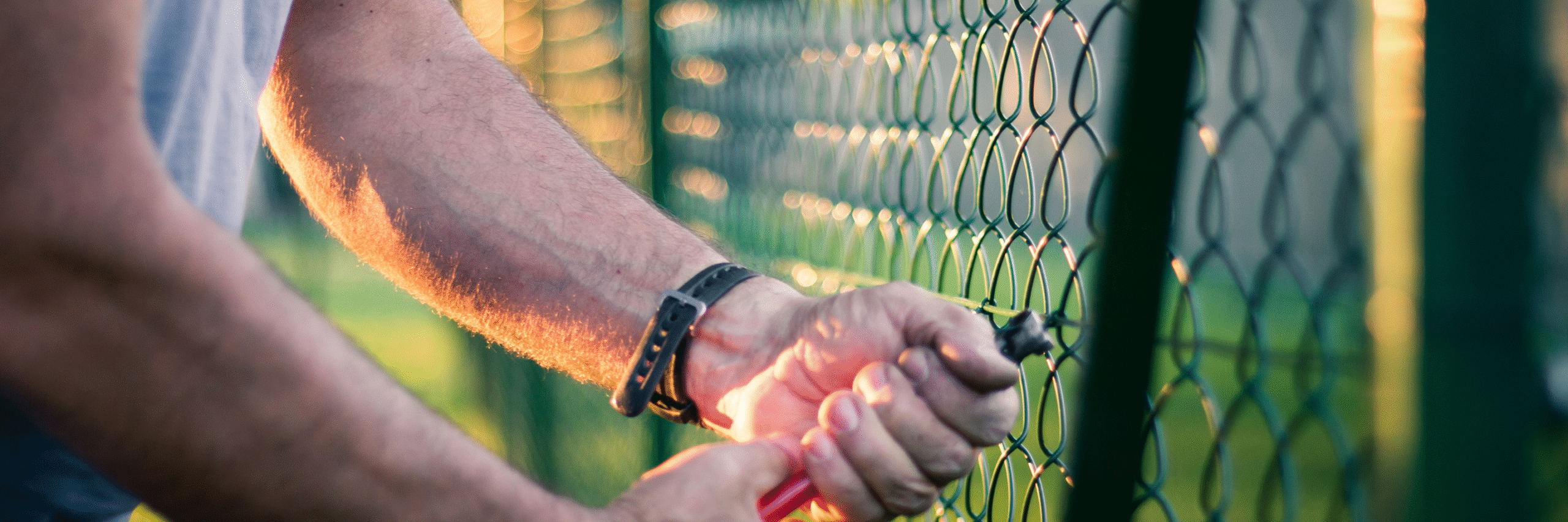 fence contractor building a chain link fence